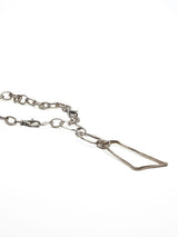 Asymmetrical silver plated necklace featuring a large geometric pendant with irregular loops and a chunky carabiner clasp.