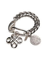 Chunky Cuban link chain bracelet featuring a sculpted pendant and engraved coin charm in a shiny silver finish.