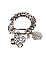 Bold silver chunky Cuban link chain bracelet featuring a sculpted pendant and engraved coin charm.