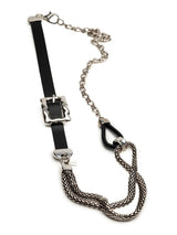 Chunky gothic necklace featuring black leather buckle and long metallic snake chains in silver tones, unisex design.