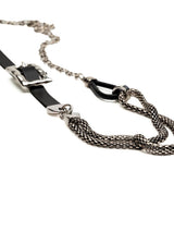 Chunky black leather choker with a large metallic buckle and long steel snake chains, edgy and versatile for unisex styling.