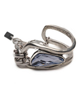 Silver ring with a blue gemstone on a white background