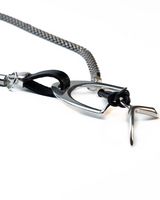 Chunky black leather and steel snake chain bracelet with a silver-coated stirrup motif, offering edgy, bold style.