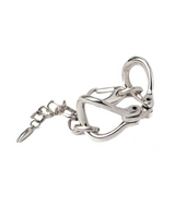 Sculptural silver cuff bracelet featuring bold organic link shapes and adjustable chain for a customizable fit.