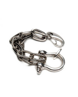 Silver shackle jewelry set featuring a chunky bracelet with textured links and a U bolt design for an edgy look.