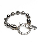 Sterling silver plated ball chain bracelet featuring a chunky design and an organic ring and bar clasp.