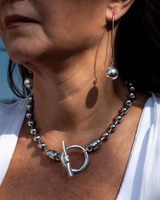 Sterling silver plated ball chain necklace and bracelet set worn together, featuring large sphere beads and a bar clasp.