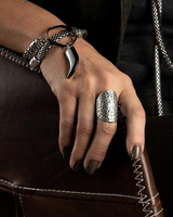Boho Rings Set displayed on a hand, featuring a large oval ethnic calendar ring with floral engravings.