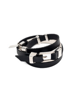 Black leather bracelet with silver metal clasp on a white background