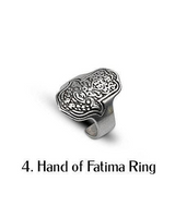 Hamsa Hand ring with intricate engraving, featuring an adjustable band in a silver finish. Ideal for stacking or solo wear.