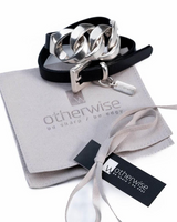Double wrap leather bracelet featuring a chunky silver chain and a buckle clasp, presented on a suede pouch.