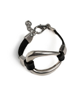 Black leather and silver metal cuff bracelet with an irregular design, featuring an adjustable chain for a perfect fit.