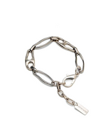 Silver boho bracelet with unique, irregular elongated links and carabiner closure from Otherwise Jewelry.