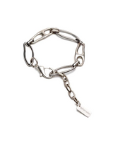 Silver bracelet with irregular chain links, featuring a carabiner closure and an adjustable extension chain.