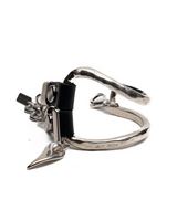 Metallic clasp with a black component on a white background