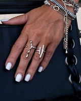 Adjustable silver-plated rings displayed on a woman's hand, featuring an irregular bar design and double bar accents.