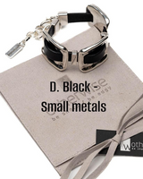 Silver bracelet with black accents on a branded box with 'Otherwise' branding.