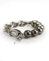 Bracelet with gray beads and silver clasp on a white background