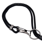 Edgy black and silver chain necklace featuring chunky oxidized tooth pendants and a durable multi-chain design.