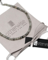 Necklace on a branded box with 'otherwise' packaging
