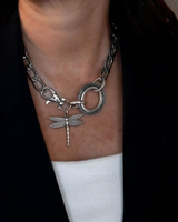 Chunky silver necklace featuring a dragonfly pendant on a thick stainless steel link chain.