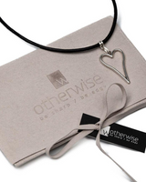 Silver heart necklace set featuring a silver-plated heart pendant on a black leather cord, presented in a suede gift pouch.
