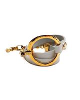 Gold and white bracelet on a white background