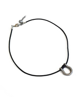 A black elastic cord necklace with a silver metal swivel clasp and a silver safety ring, displayed on a clean white background.