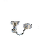 Chunky double ring set with two adjustable metal bands connected by a stainless steel chain and horse stirrup charm.