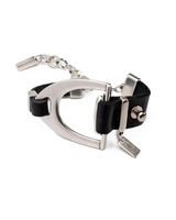 Bold black leather bracelet featuring a large sculptural silver stirrup buckle and an adjustable extension chain.