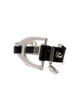 Bold black leather bracelet featuring a sculptural silver stirrup buckle, with an adjustable fit for comfort.