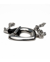 Chunky silver organic statement necklace and bracelet set features sculptural links and a black leather toggle for closure.