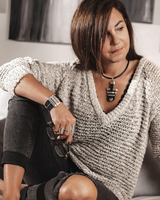Statement black leather and metal bar choker necklace worn by a model, featuring an adjustable fit and modern geometric design.