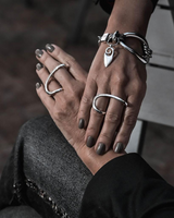 Sterling silver plated two-finger ring with a geometric design, featuring graceful curves for a stylish fit.