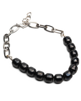 Gunmetal choker necklace featuring polished black semi-precious gemstone beads and chain links for adjustable fit.