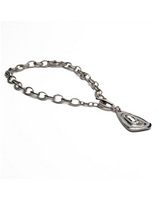 Swarovski crystal pendant necklace featuring bold silver-plated chain links, showcasing a modern, edgy design.