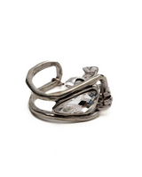 Chunky metal bracelet featuring a large clear Swarovski crystal set in textured silver-plated design.