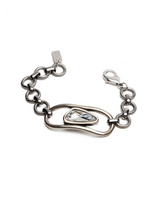 Chunky silver-plated bracelet featuring a clear Swarovski crystal centerpiece and adjustable chain links.