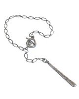 Silver necklace with a pendant on a white background