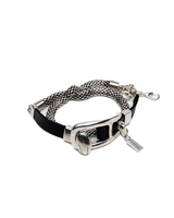Metallic dog collar with black strap on a white background