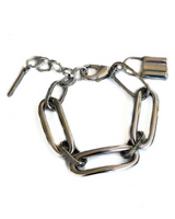 Metal chain collar with a lock on a white background