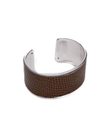 Cuff bracelet with brown leather strap and silver metal accents on a white background