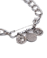 Silver bracelet with various charms on a white background