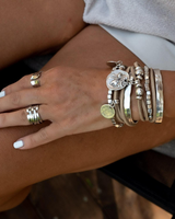 Irregular geometric ring worn on the hand, featuring a shiny silver-plated finish and sleek adjustable design.