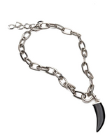 Chunky steel chain necklace featuring a black agate tooth pendant and U-bolt shackle, with an adjustable extension.