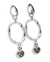 A pair of silver drop earrings with organic-shaped open loops and small round clear crystal charms, shown on a plain white background.