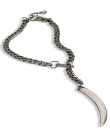 Silver chain bracelet with a curved metal pendant on a white background
