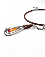 Necklace with a colorful pendant on a white background