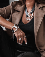 Chunky leather link set features a black leather necklace with hammered sterling silver links and a matching adjustable bracelet.