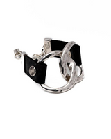 Chunky leather link bracelet featuring two hammered sterling silver plated Zamak links and a black leather band.